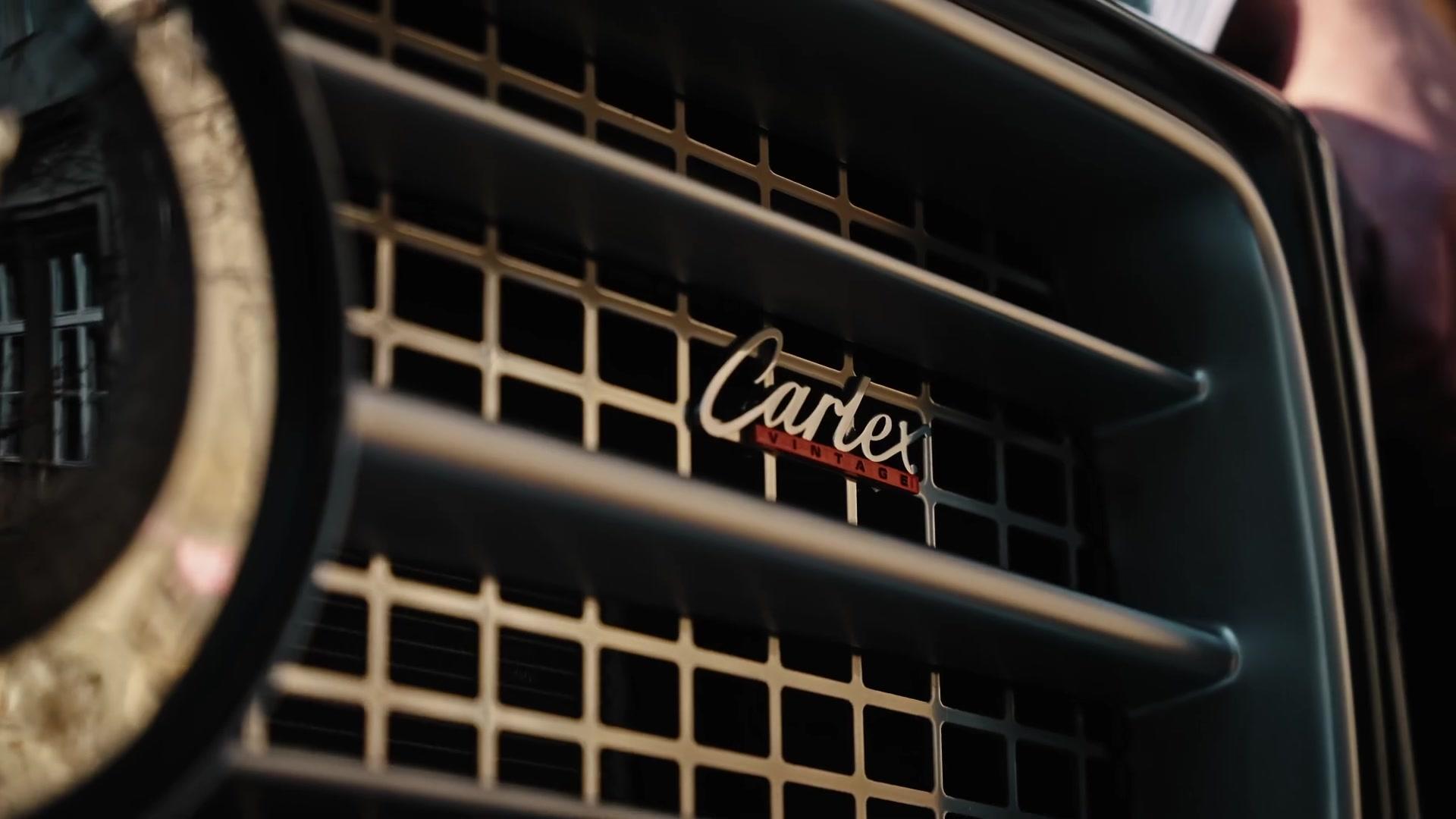 Close-up of a Carlex grille badge and chrome grille detail