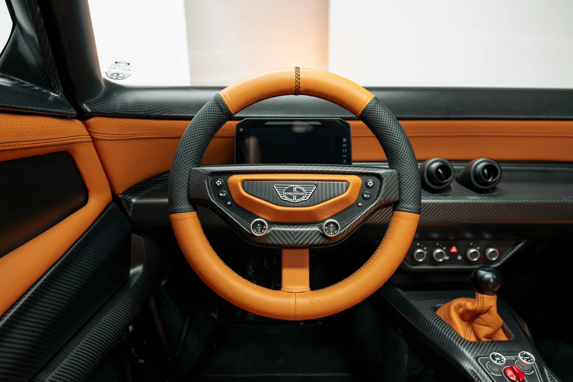 P24 RS cabin with orange leather and steering wheel