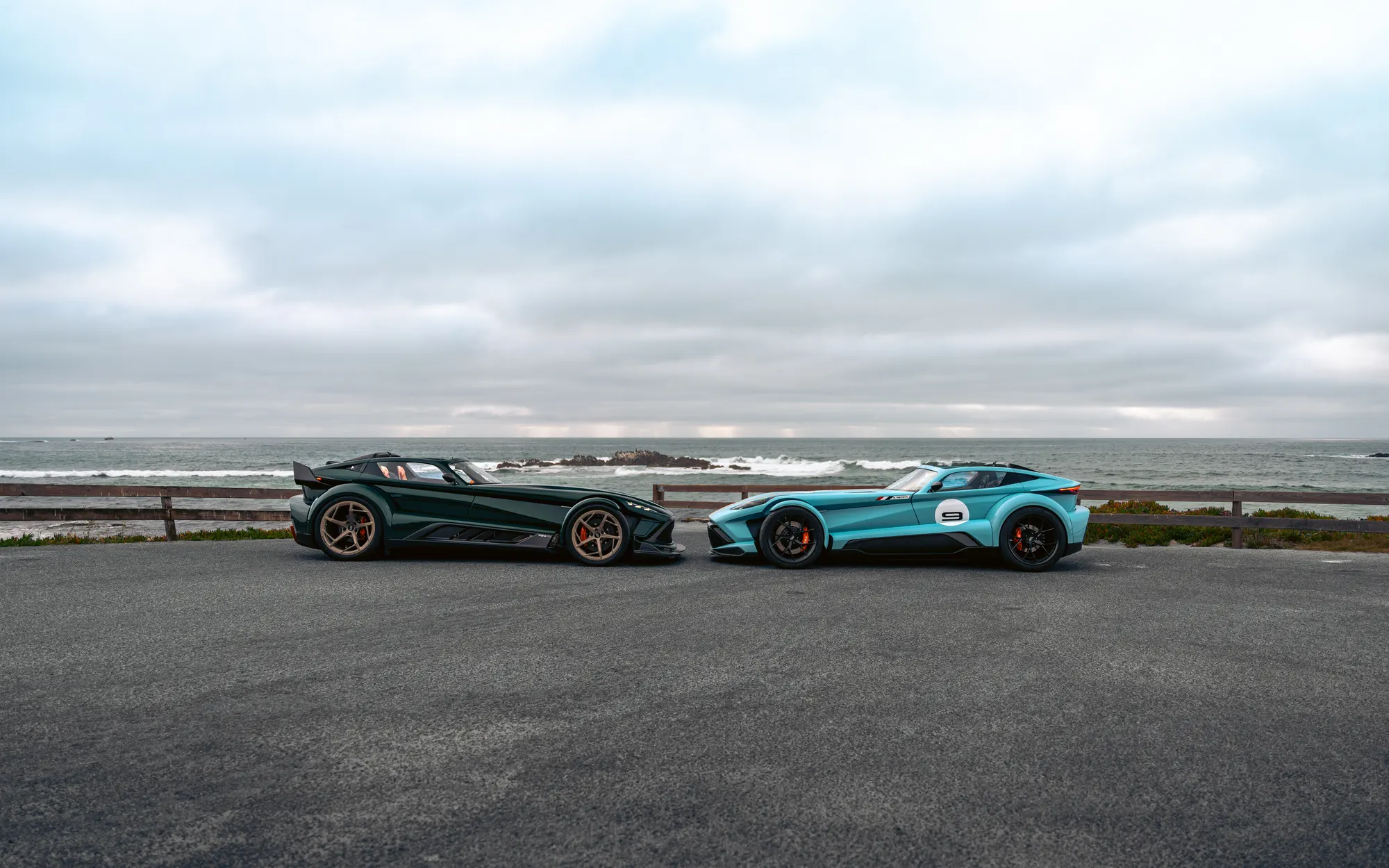 A green and a pale-blue P24 RS by the sea
