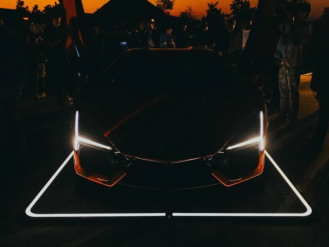 Supercar at dusk on an illuminated Fahrengold CarPad