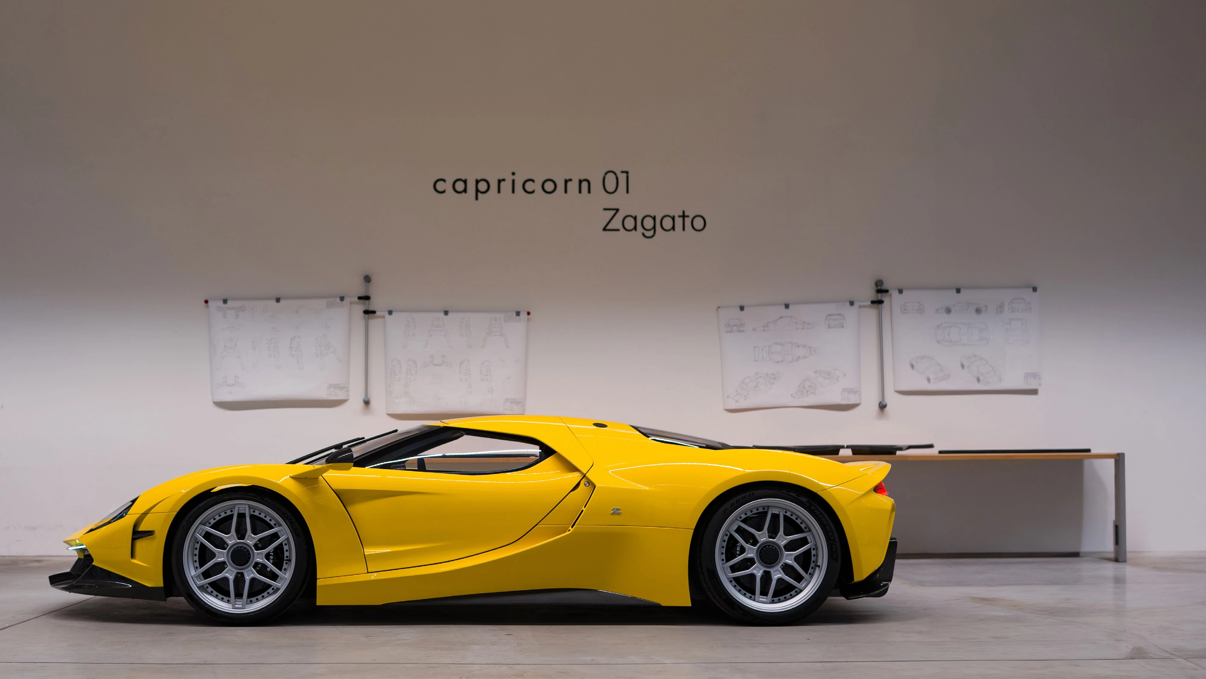The entire yellow Capricorn 01 Zagato in profile, in the workshop