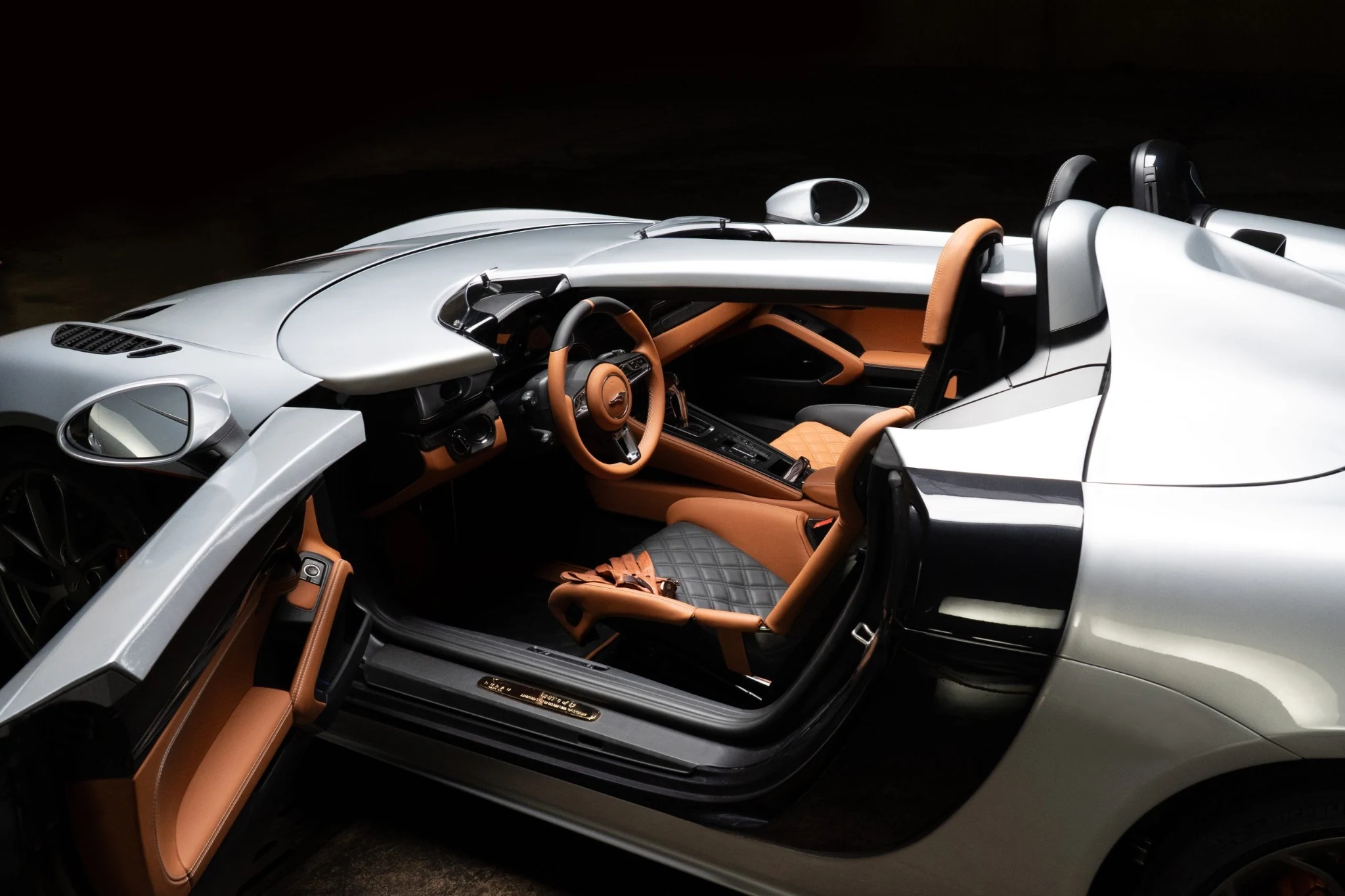 Rubau open cockpit with tan leather and a silver door