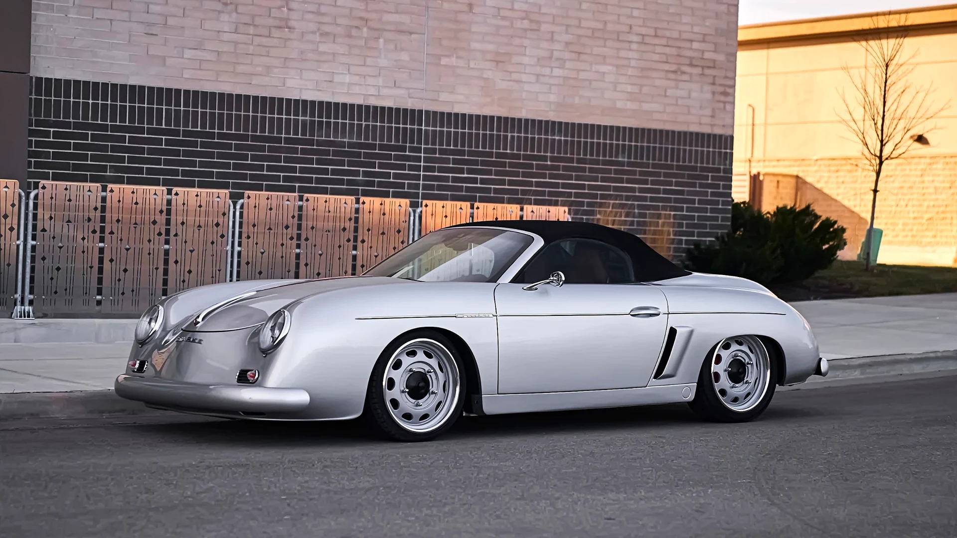 Stärke Speedster in silver beside a modern building